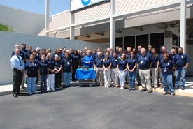 custom manufacturing and engineering comapny photo with all employees and power supply